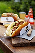 Poultry sausage hot dog with onions, sultanas, lettuce and mayonnaise
