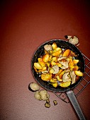 Spicy fried potatoes and black summer truffles