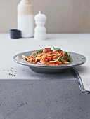 Spaghetti with meatballs in an oriental tomato sauce
