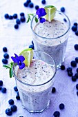 Two blueberry and lime milkshakes