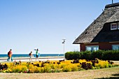 Baltic Sea resort, Kühlungsborn, Mecklenburg-Vorpommern - thatched roof house on the promenade