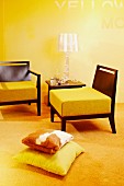 Living room in shades of yellow - chairs with thick seat cushions on wooden frames and plexiglass designer table lamp