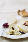 A cheese platter with a fennel and date salad