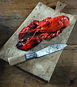 A lobster on a chopping board