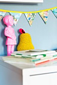 Hand-sewn, colourful bunting in child's bedroom