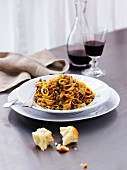 Tagliatelle with beef bolognese served with foccacia and red wine