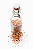 A bottle of colourful sugar sprinkles
