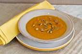 Butternut squash soup with carrots, maple syrup, cinnamon and pumpkin seeds