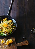 Oriental scrambled eggs with an orange and bean sprout salad