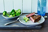 Spiced rump steak and steamed broccoli