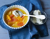Orange and grapefruit compote with whipped cream