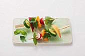 Vegetable skewers with herbs and fruit