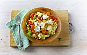 Fried couscous and vegetables with goat's cheese