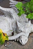 Stone dragon on garden wall