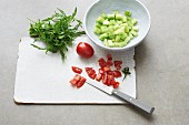 Diced tomatoes, cucumber and bunch of rocket
