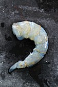 A peeled, raw king prawn
