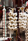 Strings of garlic at a market