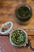 A dried herb mixture in a preserving jar