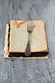 A fork on an old recipe book