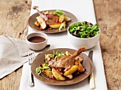 Duck confit with roast potatoes and salad