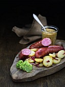 Rustic bratwurst with potato salad and mustard