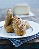 Hearty bread rolls with raisins and sesame seeds