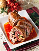 Beef roulade with garlic, bread crumbs, ham, raisins, walnuts and romano cheese (Christmas)