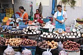 Taro and yam sellers at a market, Thailand