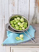 Brussels sprouts in metal colander