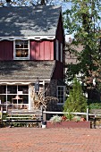 Farmhouse with barn in country