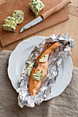 Salmon with herb butter in aluminium foil