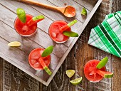 Watermelon cocktails on a rustic wooden tray