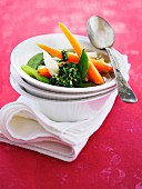 Clear broth with colourful vegetables
