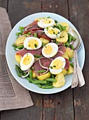 Salad Nicoise with green beans, potatoes, smoked tuna and boiled eggs
