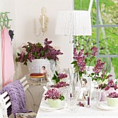 Spring atmosphere - table set for afternoon coffee decorated with lilac