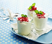 Yoghurt and cream with pomegranate seeds and mint