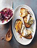 Grilled bread topped with pear, brie and radicchio salad