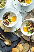 Oeufs cocotte with bacon and croutons