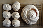 Various sized meringues on a wire rack