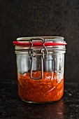 A jar of homemade tomato sauce