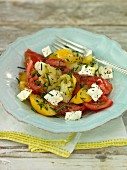 Tomato salad with feta cheese and chives