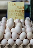 Fresh white eggs in an egg box