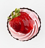 A strawberry cupcake seen from above