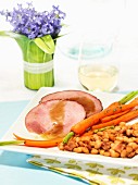 Roast ham with gravy and carrots for Easter