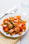 Carrot tagliatelle with prawns, peas and pine nuts