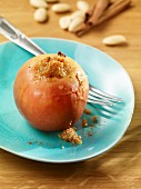 A baked apple with almonds