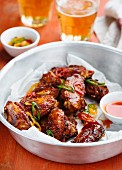 Chicken wings with chilli sauce and beer
