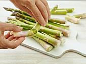 Asparagus tips being broken off