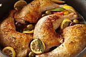 Chicken legs with lemons and olives