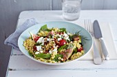 Millet and herb salad with fresh figs, sheep's cheese and almonds